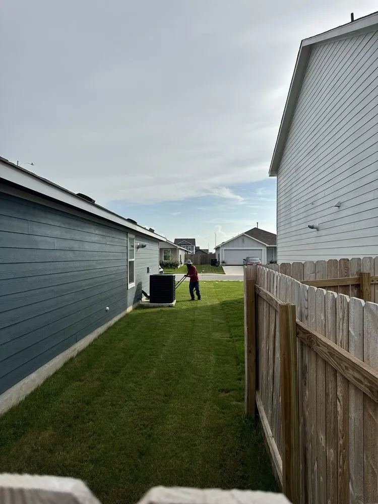 Professional lawn mowing service with custom design in Lockhart, TX by Lawn Barbers