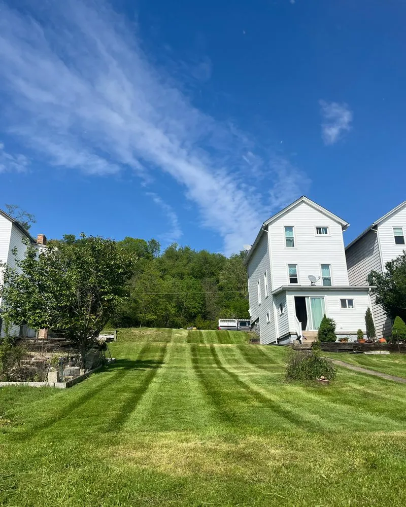 Expert lawn mowing service for residential properties in Freedom, PA by Lawn Boys Landscaping