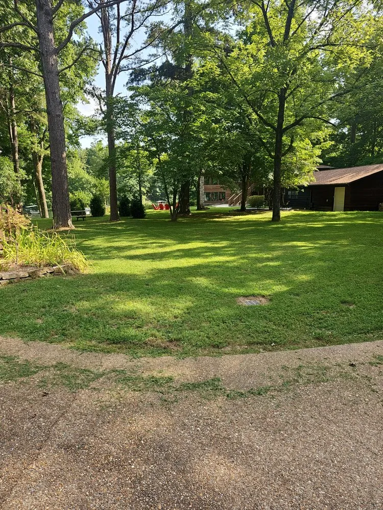 Affordable lawn mowing service for residential properties in Quitman, AR by Lawn Champs