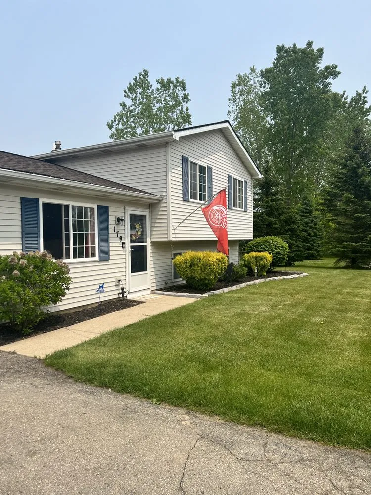 Local landscape installation with custom design in Pinckney, MI by Lawn Critters