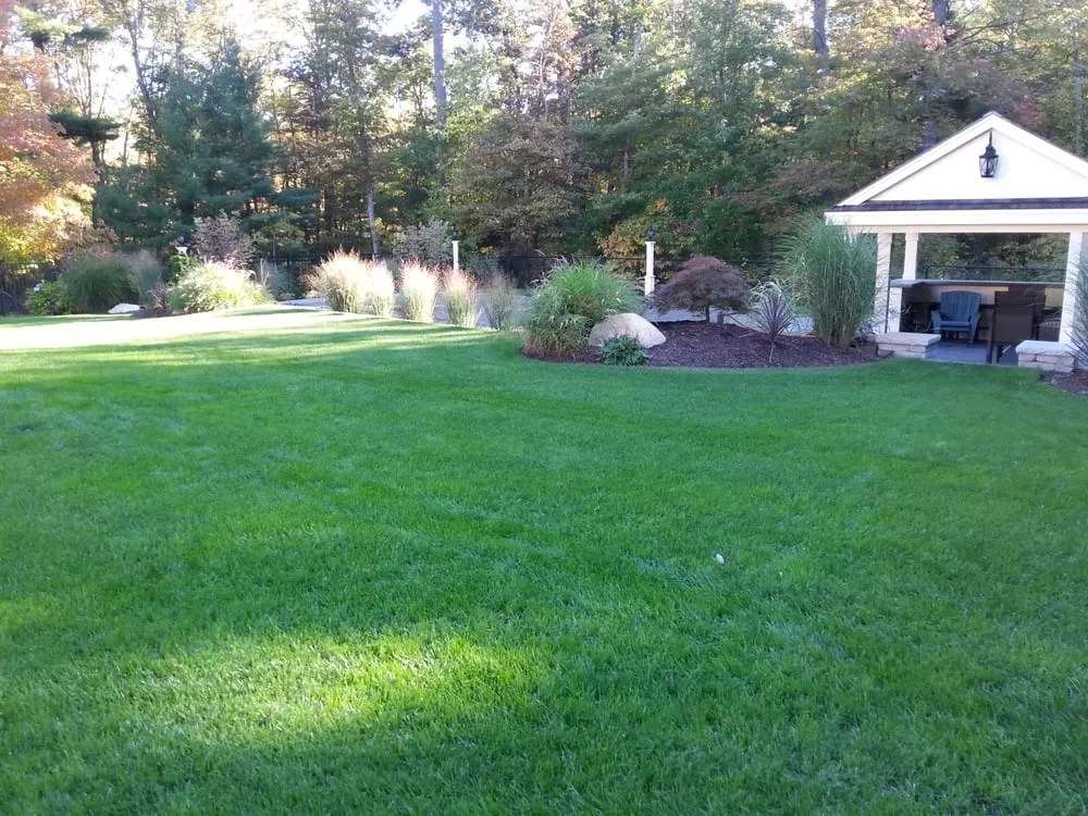 Professional outdoor landscaping for homes across Raynham, MA - Lawn Dawg
