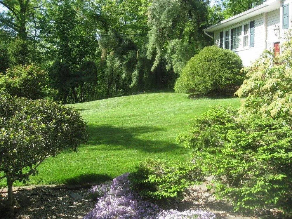 Custom outdoor landscaping for year-round maintenance in Rocky Hill, CT by Lawn Dawg