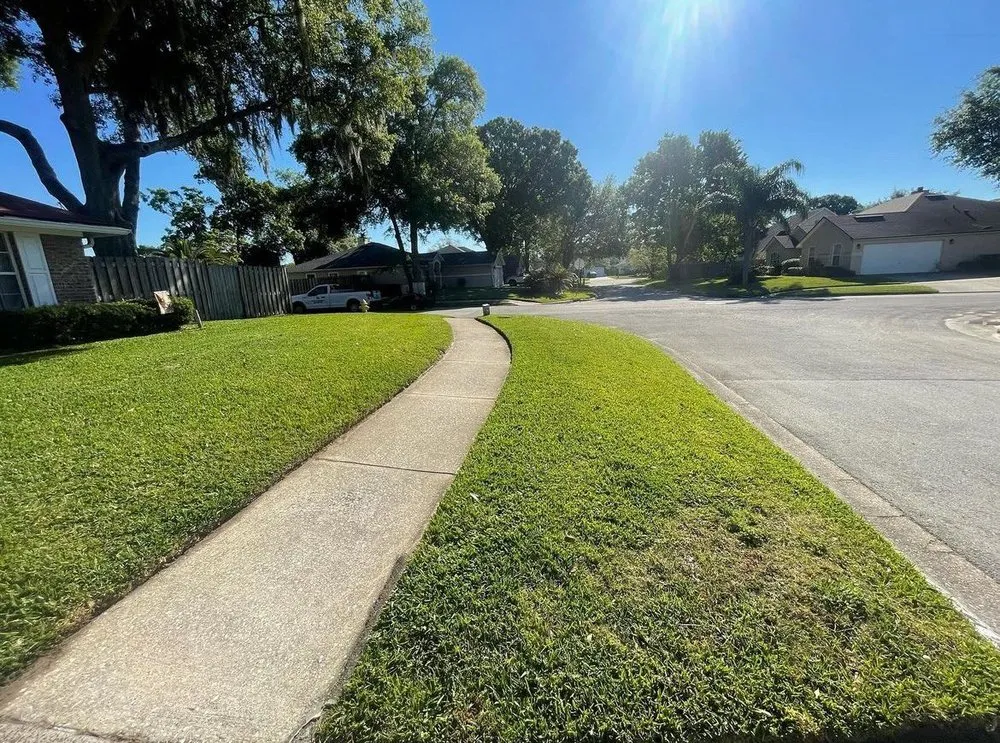 Professional yard maintenance for residential properties across Jacksonville, FL - Lawn Impressions