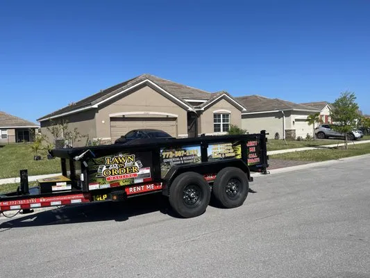 Lawn In Order Landscaping and Lawn Care Logo