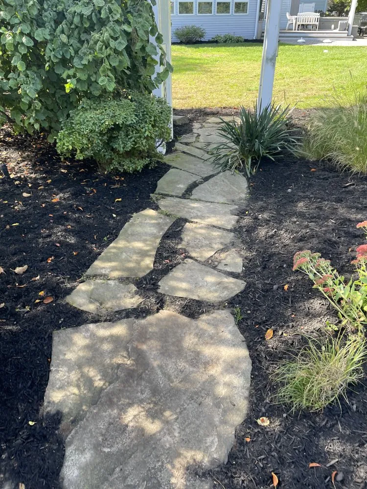 Professional garden landscaping with custom design in Ronkonkoma, NY by Lawn Island Landcaping