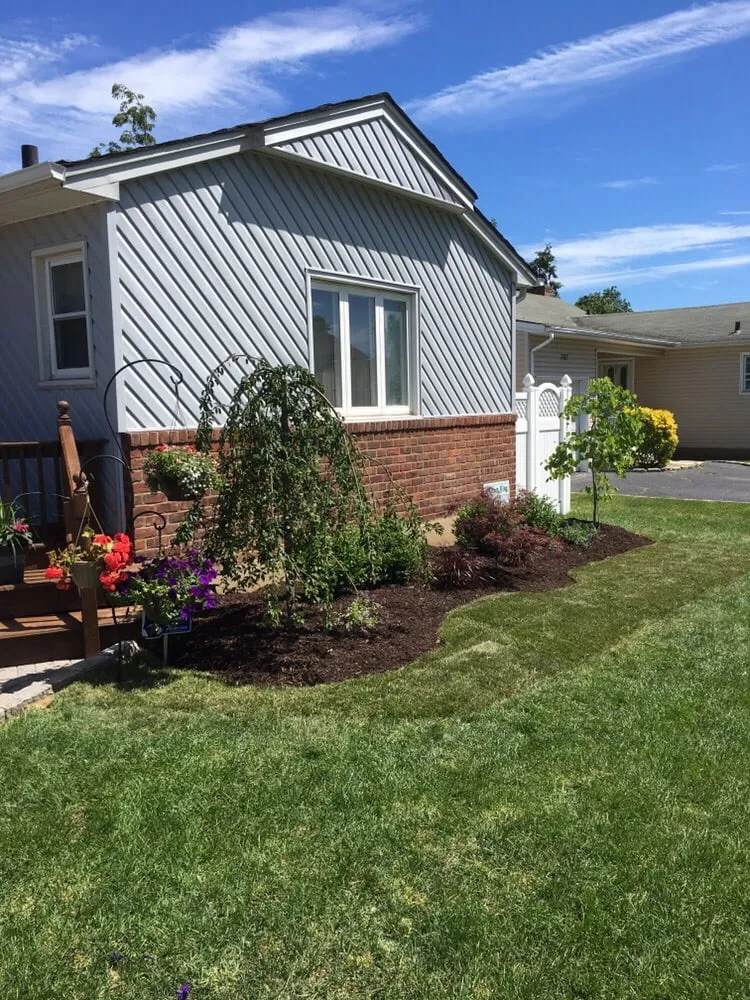 Custom landscape design in Wantagh, NY by Lawn King Design & Maintenance
