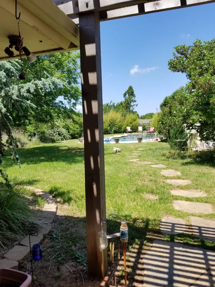 Custom garden landscaping for year-round maintenance in Oklahoma City, OK by Lawn Love Lawn Care