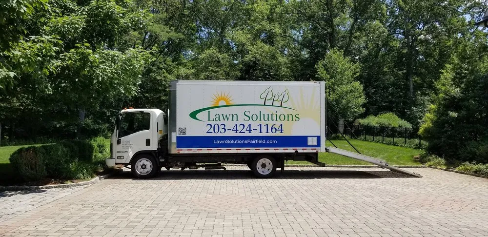Local landscape design for year-round maintenance across Cos Cob, CT - Lawn Solutions