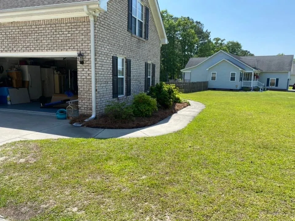 Custom landscape design for year-round maintenance in New Bern, NC by Lawn Trimmers