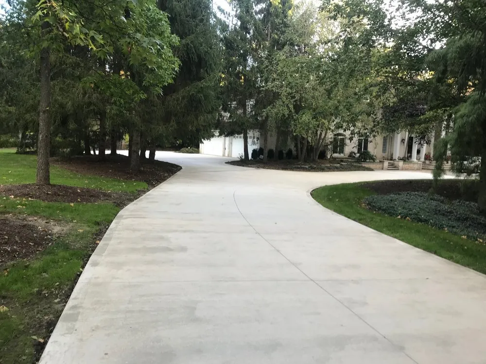 Custom outdoor landscaping in Chesterland, OH by LawnMark Concrete Driveway and Patio