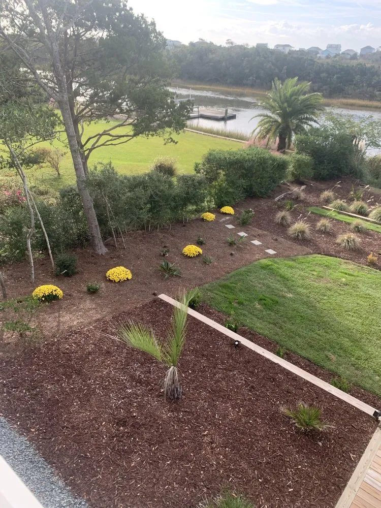 Custom yard cleanup service with custom design in Oak Island, NC by Lawns of the East Coast