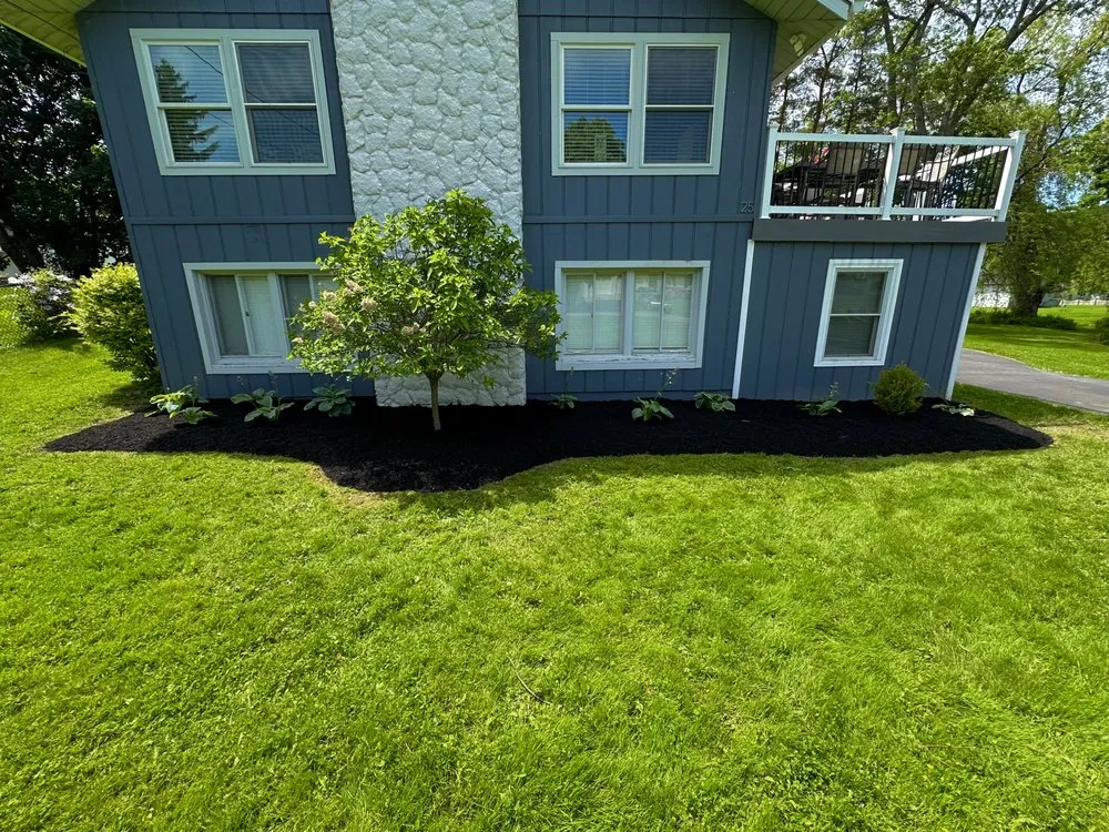 Custom lawn care service for residential properties in Orchard Park, NY by LB Landscape and Design