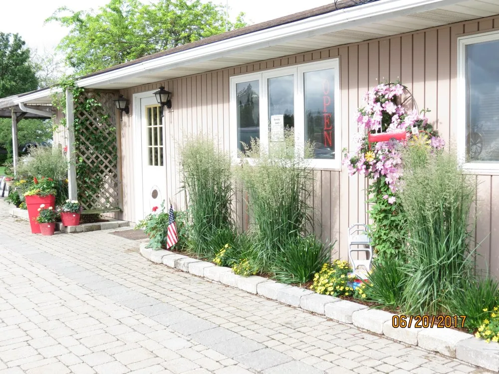 Reliable lawn mowing service with custom design in Bay Port, MI by Lee's Landscaping