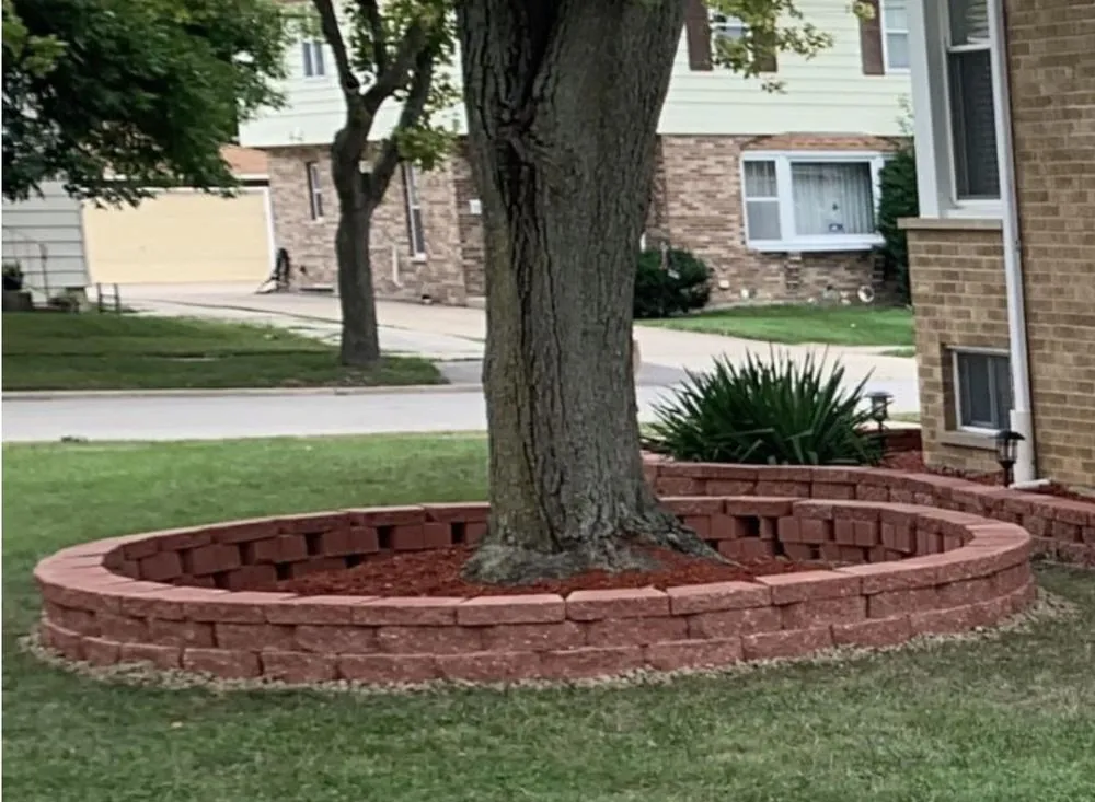 Custom landscape design for year-round maintenance in Maywood, IL by Lets Reason Lawn Service