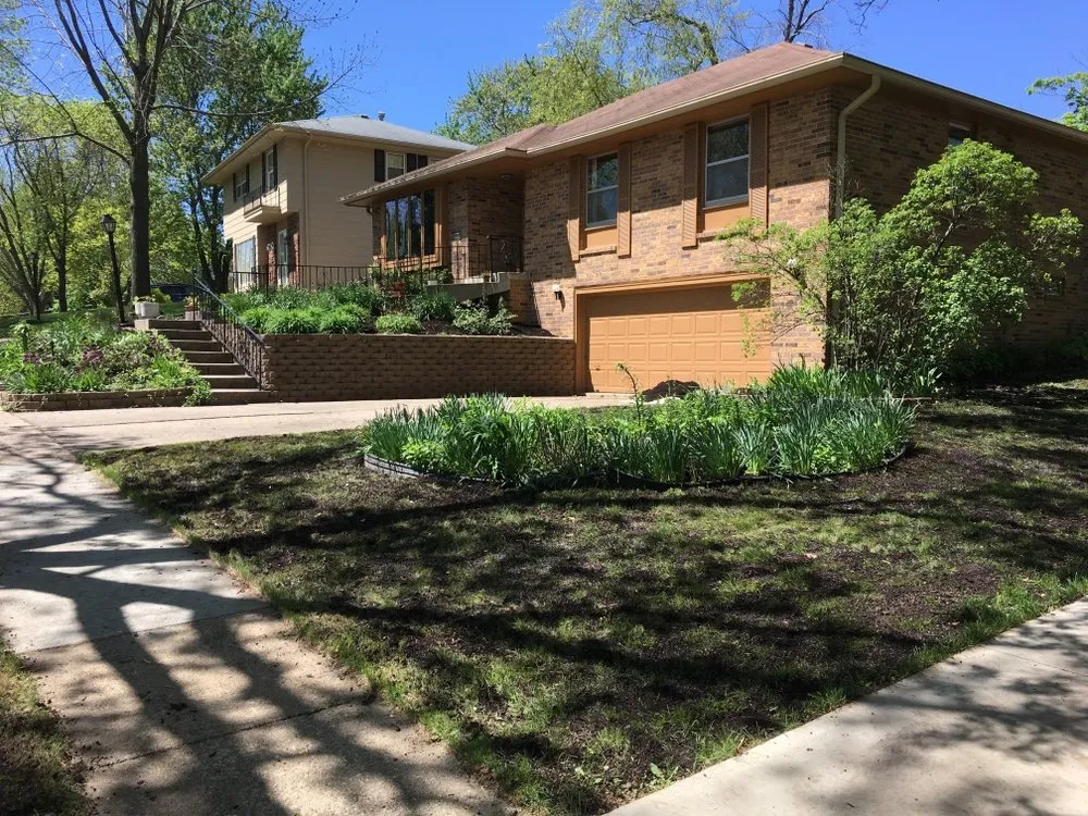 Professional landscape installation for residential properties in Des Moines, IA by Lewis Lawn & Labor
