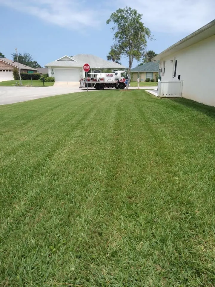 Professional lawn mowing service for homes in Port Orange, FL by Liberty Lawn and Pest