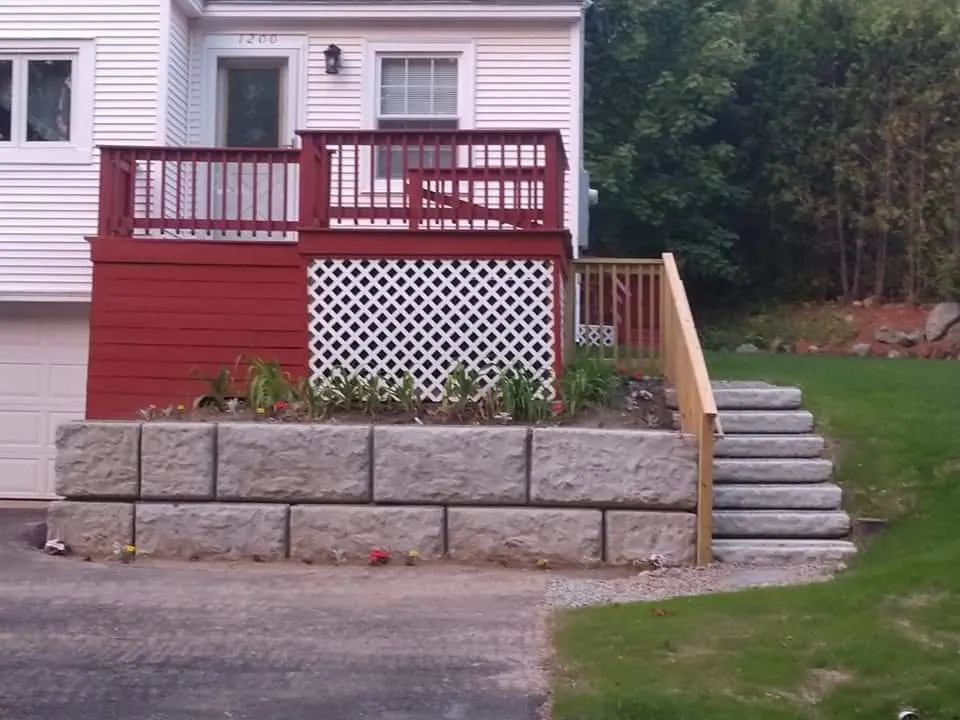 Custom landscape installation with custom design in Auburn, MA by Little Diggers Construction