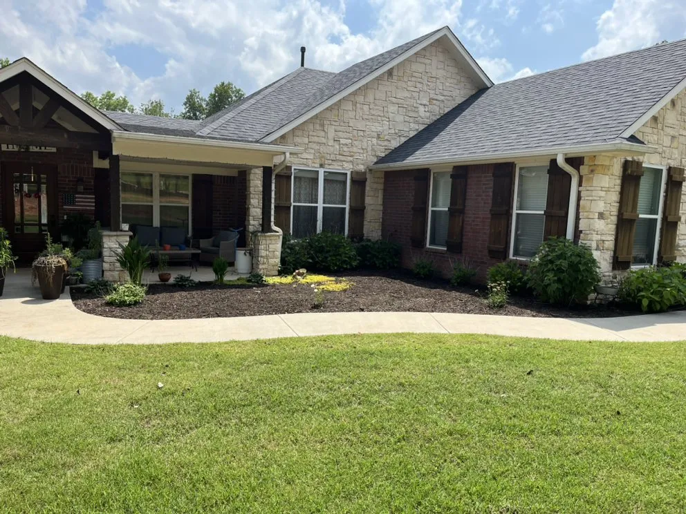 Custom landscape installation for beautiful yards in Tecumseh, OK by Little Footes Landscaping