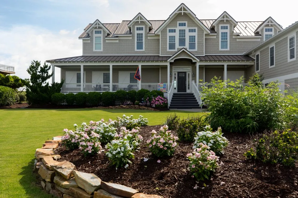 Professional lawn mowing service for year-round maintenance in Powells Point, NC by Living Oaks Landscaping & Tree Services