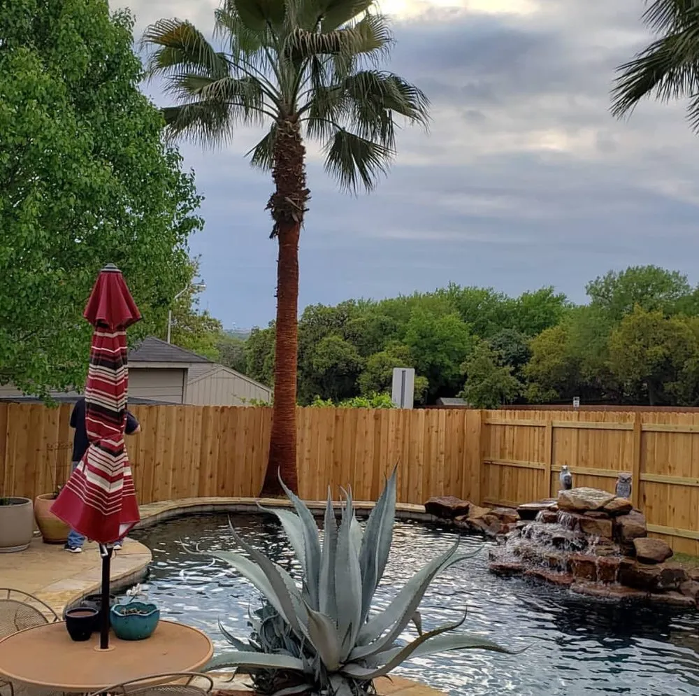 Custom landscape installation for homes in New Braunfels, TX by Lone Oak Tree Care