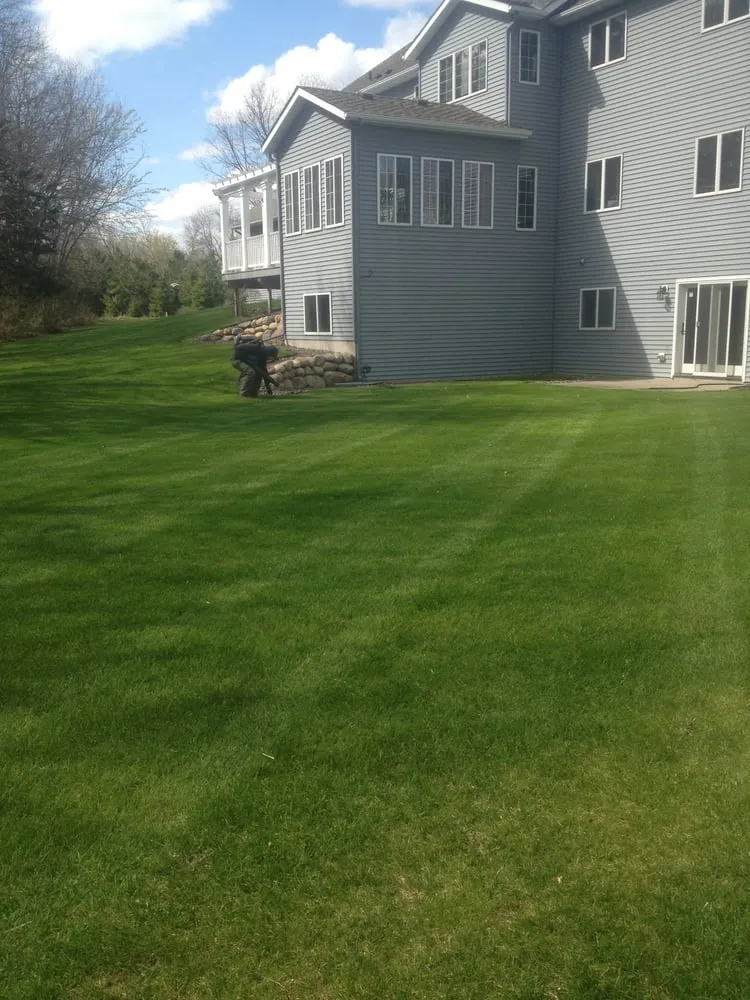 Professional yard cleanup service for residential properties in Royalton, MN by Looking Good Lawn & Landscape Maintenance