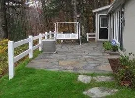 Custom landscape installation with custom design in Arlington, VT by LoriMark Landscaping