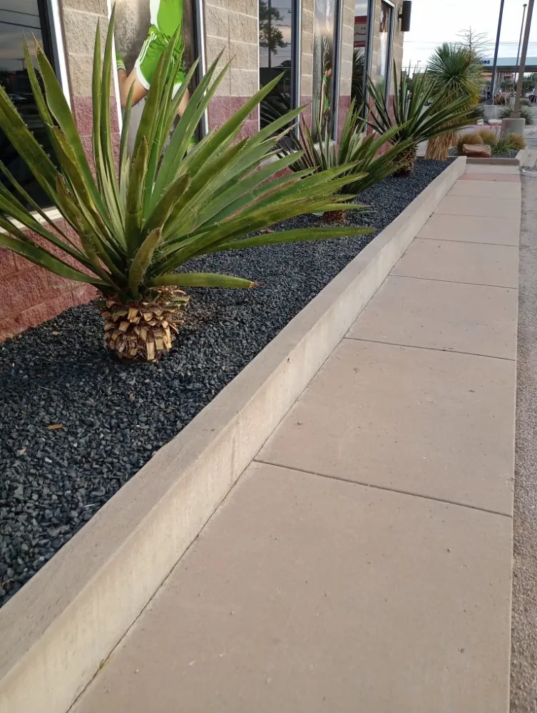 Custom outdoor landscaping in Midland, TX by Lo's Yard Services