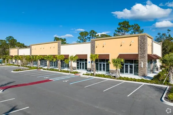 Louvier Quality Lawn Care Logo