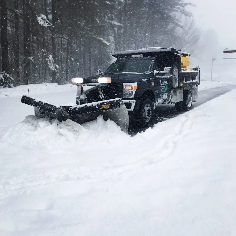 Top-rated lawn mowing service for year-round maintenance in Dracut, MA by Lowe's Landscaping Services