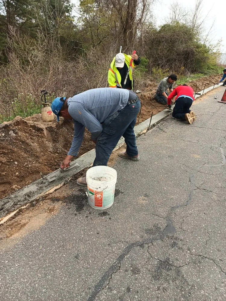 Professional lawn mowing service for homes in Brentwood, NY by López Landscaping Desing and Tree Service