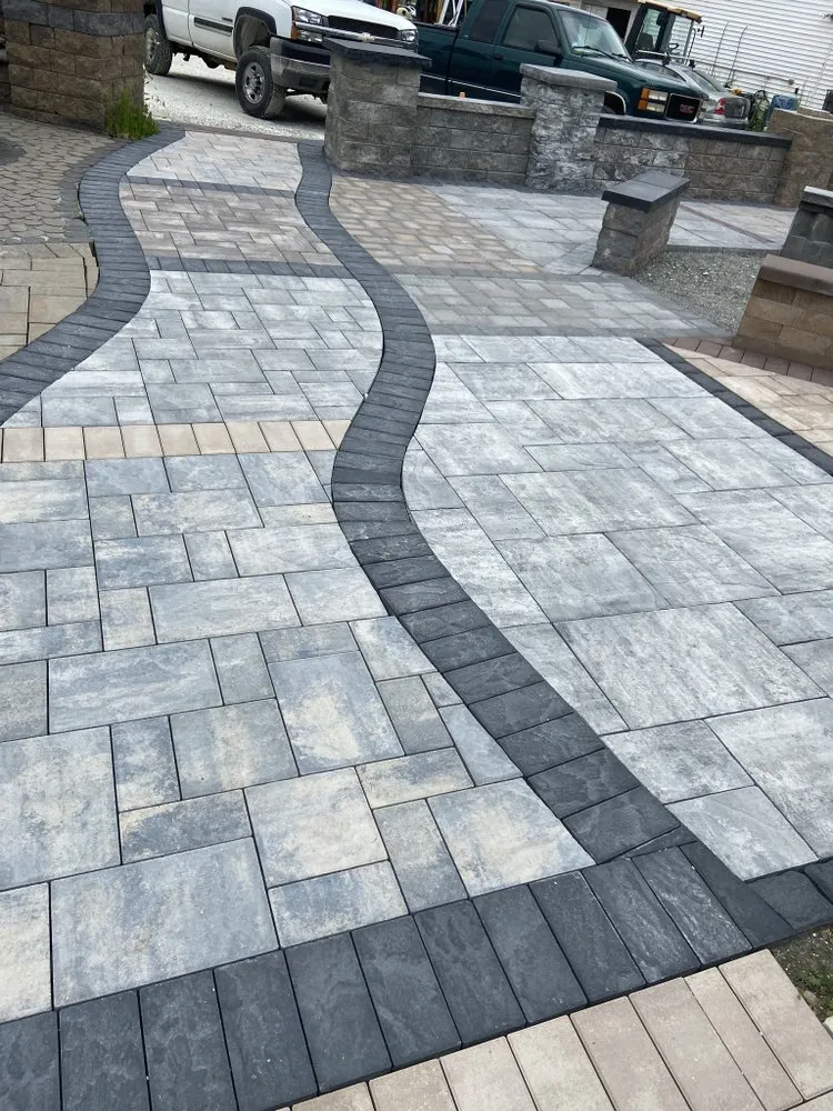 Custom lawn mowing service for outdoor upgrades in Boston, MA by López Masonry and Landscaping