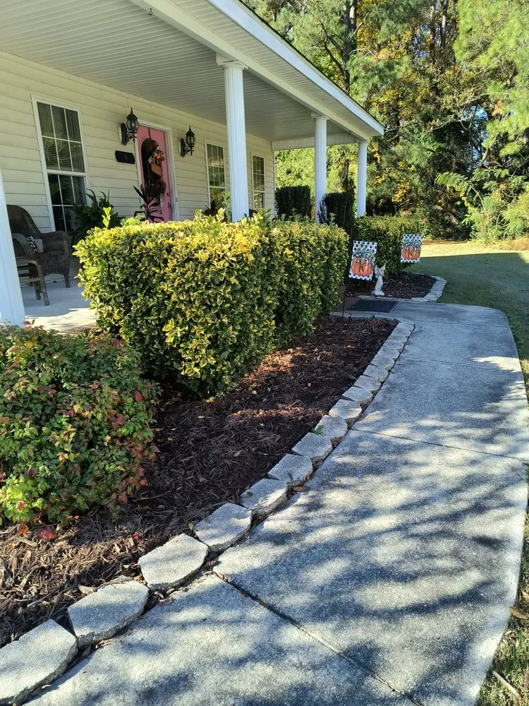 Professional lawn mowing service for residential properties in Newport, NC by Lucky 13 Lawn Care