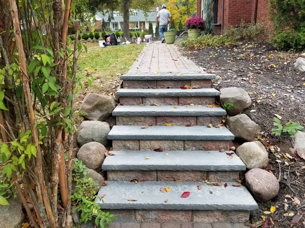 Affordable lawn mowing service for year-round maintenance in Orange, NJ by Luigi General Contractors Paving & Landscaping