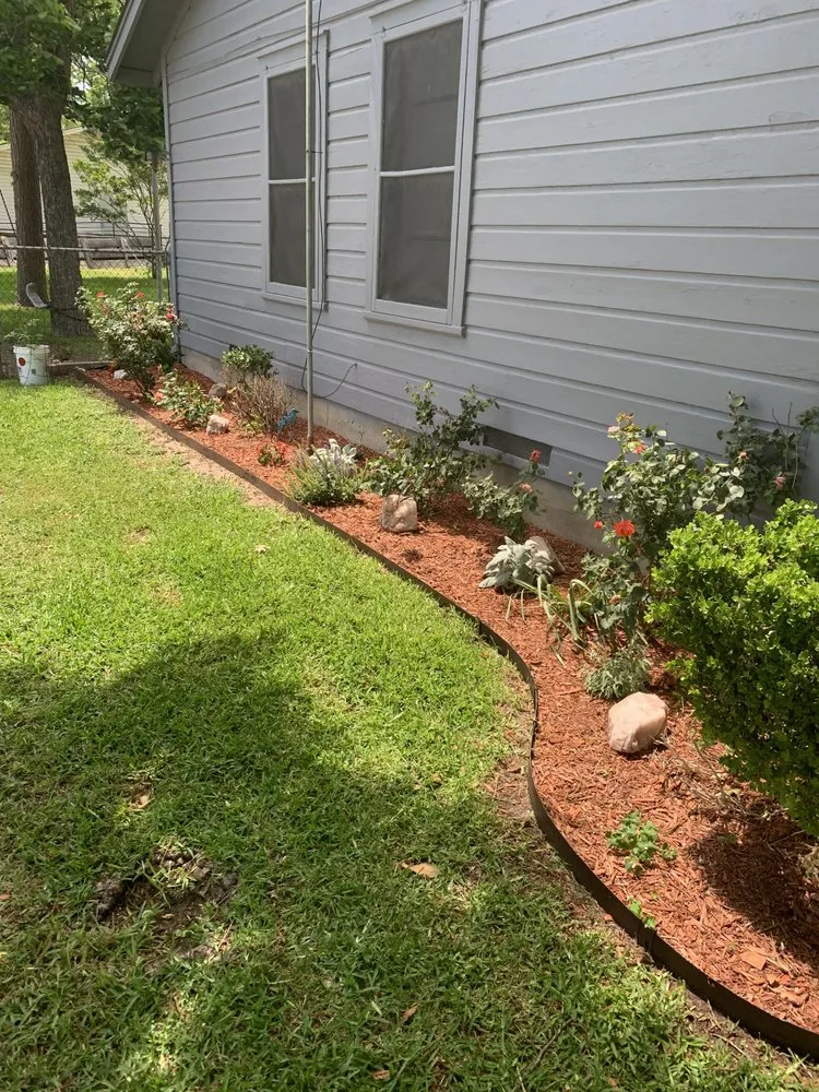 Professional residential landscaping in Ennis, TX by Luksa Lawn Care & Handyman Services