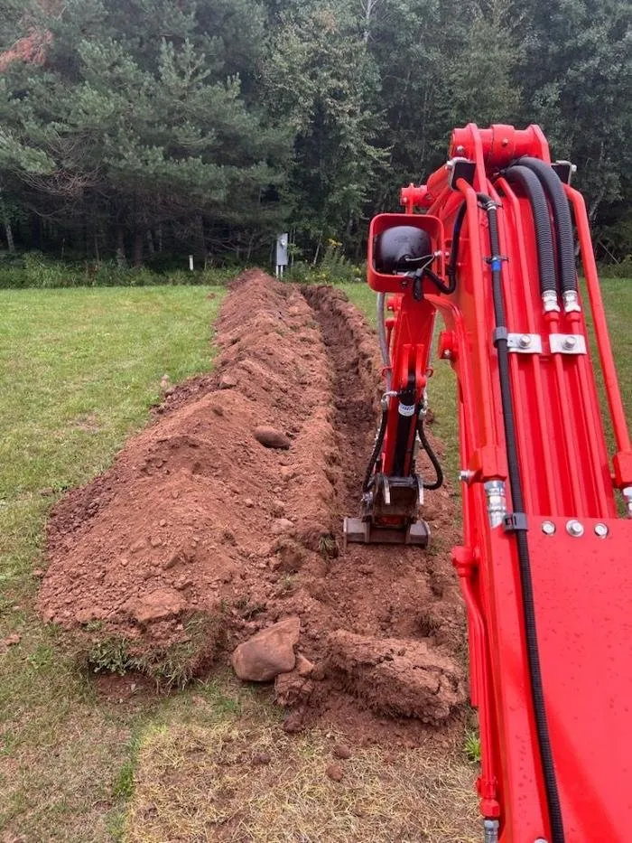 Custom landscape installation in Wrenshall, MN - Lustigs Mini Excavation