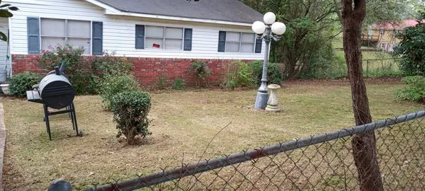 M & E Pressure Washing and Lawn Care Services Logo