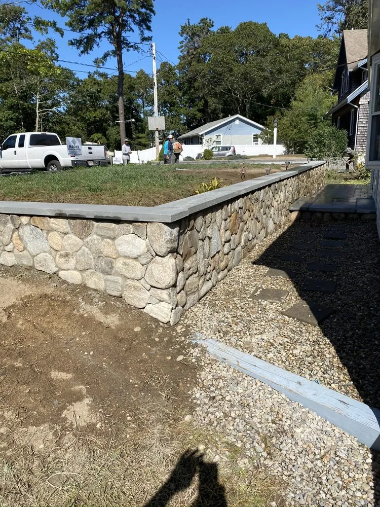 Local lawn care service for outdoor upgrades in West Yarmouth, MA by Maciel Construction