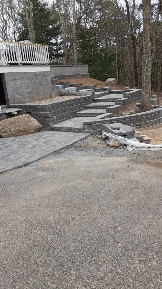 Professional lawn mowing service for residential properties in West Yarmouth, MA by Maciel Construction