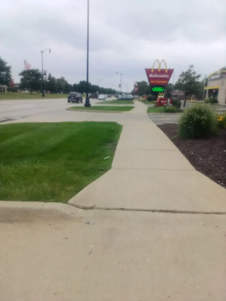 Local lawn mowing service with custom design in Taylor, MI by M.A.D. Landscaping