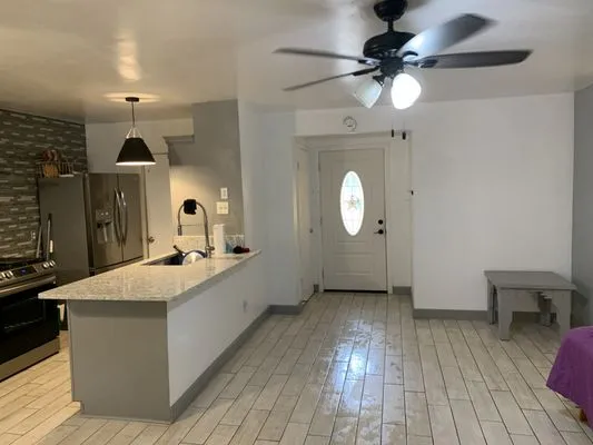 Magic Manny's Lawn Care Logo