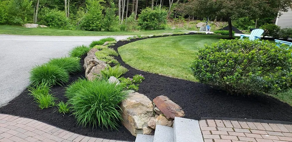 Custom residential landscaping for year-round maintenance in Belmont, NH by Magic Overnight Landscaping
