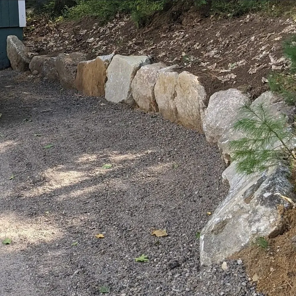 Custom landscape installation in Brownfield, ME by Mainely Wood & Stone