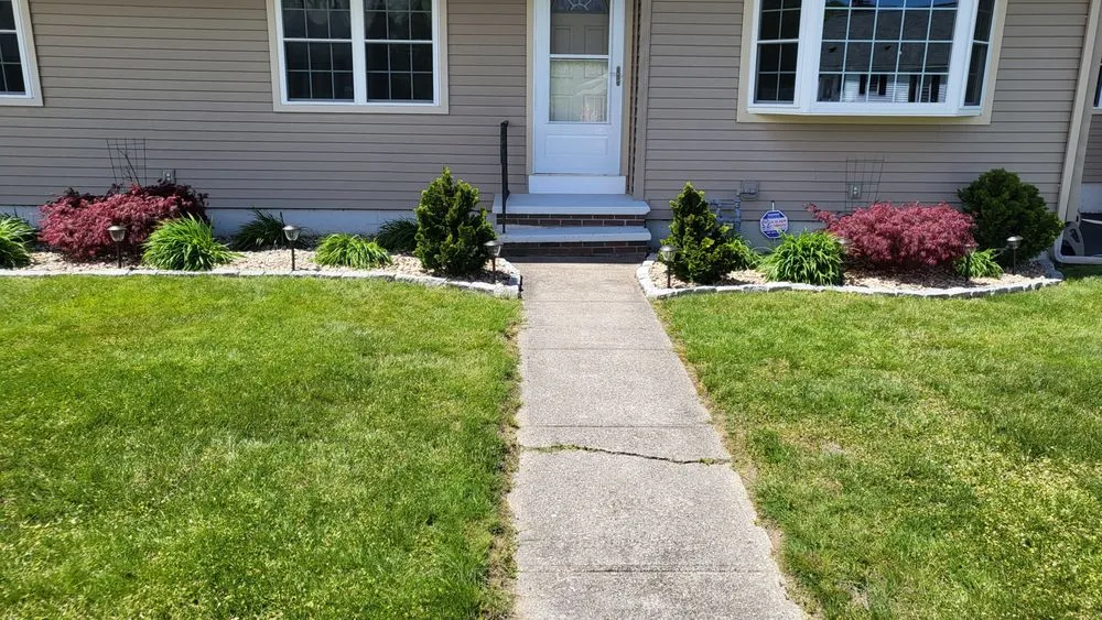 Professional yard cleanup service with custom design in Millville, MA by Maloney Lawn Care