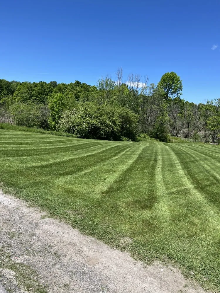 Professional lawn mowing service for residential properties in Gouverneur, NY by Maloy’s Lawn Care And Snow Removal