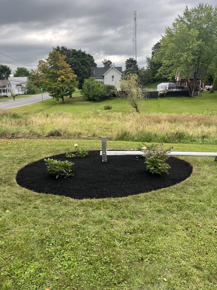 Custom outdoor landscaping with custom design in Gouverneur, NY by Maloy’s Lawn Care And Snow Removal