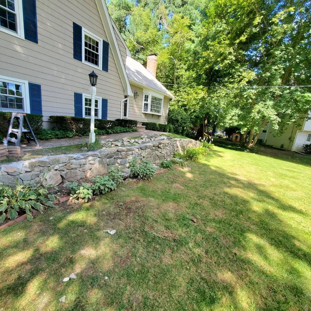 Custom landscape installation for year-round maintenance across Ipswich, MA - Maney Landscaping & Tree Service