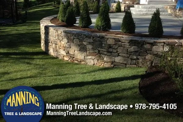 Custom residential landscaping for year-round maintenance across Acton, MA - Manning Tree & Landscape
