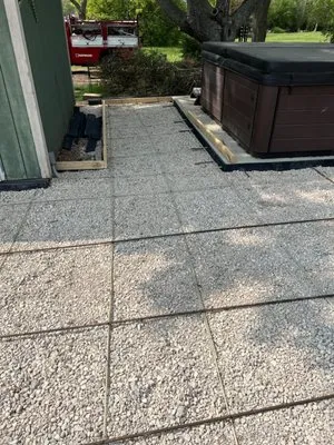 Manny Concrete And Landscaping Logo