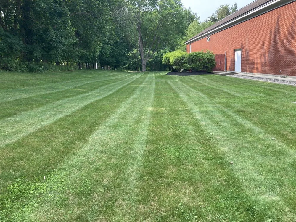 Professional lawn mowing service for homes in Lynn, MA by Manolos Landscaping