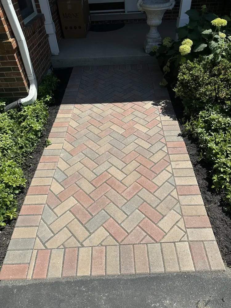 Custom lawn mowing service for residential properties in Waukegan, IL by Manuel Brick Paving & Landscaping